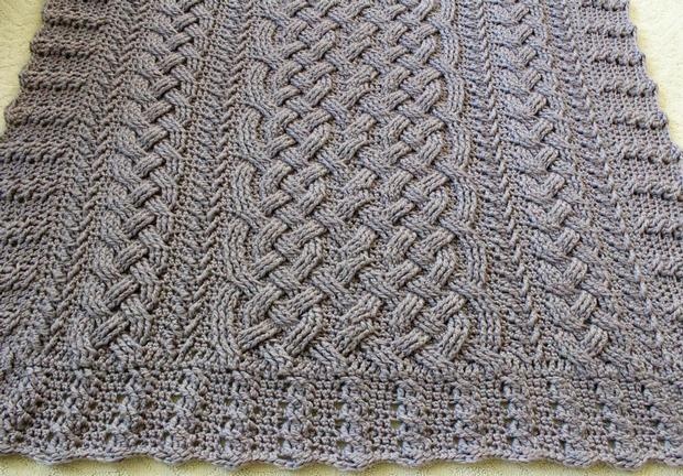 Quote from creator's blog post: A pretty braided cable dishcloth