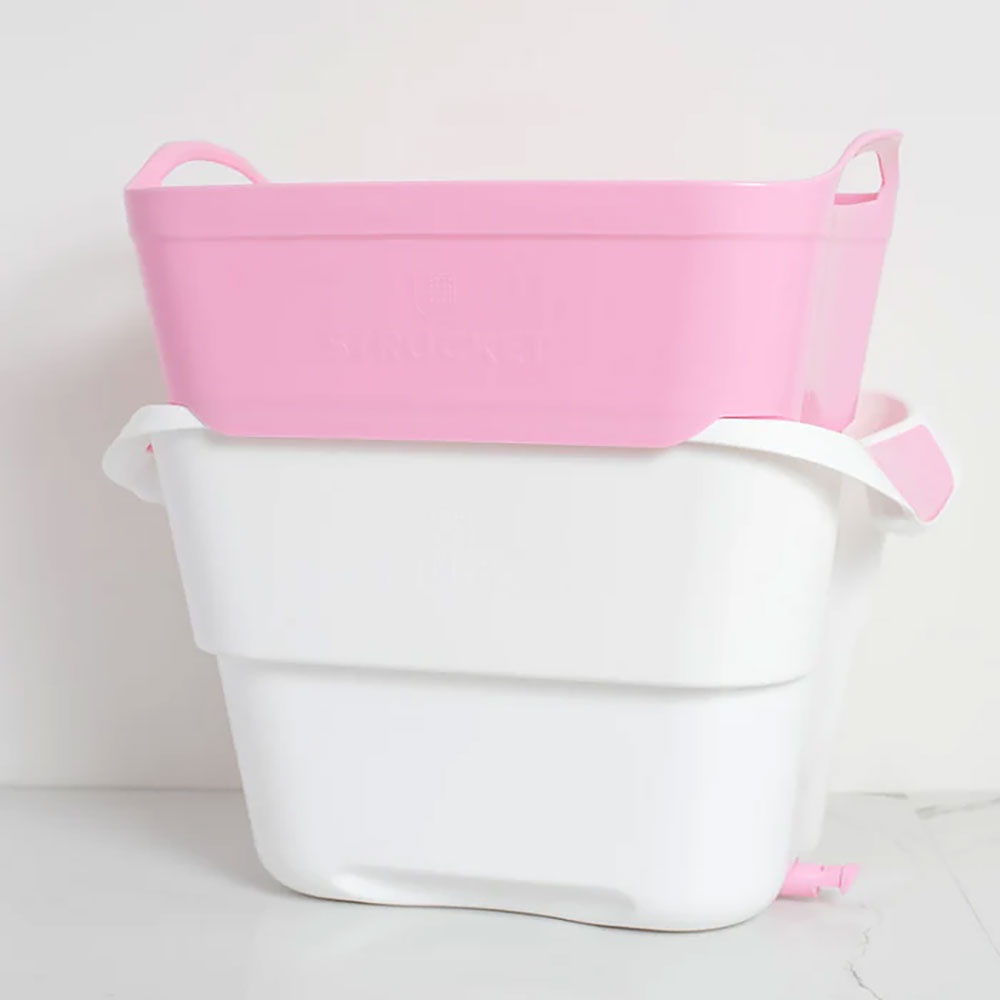 a pink and white strucket tub